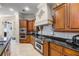 Gourmet kitchen features custom cabinets, granite countertops, and stainless steel appliances at 8814 Southern Breeze Dr, Orlando, FL 32836
