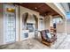 Covered outdoor kitchen with stainless steel grill and comfortable seating at 8814 Southern Breeze Dr, Orlando, FL 32836