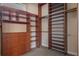 Custom walk-in closet with built-in storage and closet organizers for optimal space at 8814 Southern Breeze Dr, Orlando, FL 32836