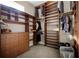 Walk-in closet with custom wood shelving, drawers, and ample storage space at 8814 Southern Breeze Dr, Orlando, FL 32836