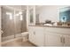 Modern bathroom with a glass-enclosed shower, white vanity, and neutral tones, offering a clean and contemporary design at 8986 Cabot Cliffs Dr, Davenport, FL 33896