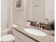 Clean bathroom with a shower-tub combo, a light countertop and white fixtures at 8986 Cabot Cliffs Dr, Davenport, FL 33896