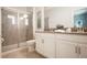 Contemporary bathroom with a glass-enclosed shower, modern vanity, and sleek design elements at 8986 Cabot Cliffs Dr, Davenport, FL 33896