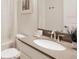 Bright and clean bathroom featuring a modern vanity, tub with shower, and stylish finishes at 8986 Cabot Cliffs Dr, Davenport, FL 33896
