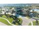 Upscale clubhouse with porte cochere, lush landscaping, and well-maintained sidewalks and lawn at 8986 Cabot Cliffs Dr, Davenport, FL 33896