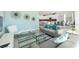 Cozy living room showcases modern decor, a large sofa, a decorative rug, and a view into the kitchen at 8986 Cabot Cliffs Dr, Davenport, FL 33896