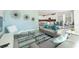 Bright, open-concept living room with modern furnishings and decor that seamlessly integrates with the kitchen at 8986 Cabot Cliffs Dr, Davenport, FL 33896
