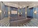 Modern screening room with comfortable seating, large projector screen, and stylish decor at 8986 Cabot Cliffs Dr, Davenport, FL 33896