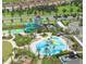An aerial view showcases The Retreat Club's pools, waterslides, and amenities at 9061 Dogleg Dr, Davenport, FL 33896