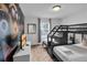 bedroom featuring a bunk bed, TV, and fun minion wallpaper at 9061 Dogleg Dr, Davenport, FL 33896