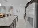 Stylish kitchen featuring granite countertops, stainless steel appliances, and dark wood cabinetry at 9061 Dogleg Dr, Davenport, FL 33896