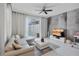 Comfortable living room features gray sectional, modern decor, and a view of the enclosed pool area at 9061 Dogleg Dr, Davenport, FL 33896
