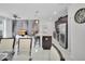 Open-concept living space featuring the kitchen, dining room, and living room at 9061 Dogleg Dr, Davenport, FL 33896