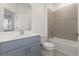 Clean bathroom featuring a tub/shower combination, a vanity with ample counter space, and neutral finishes at 9108 Wildlight, Wildwood, FL 34785