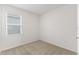 Comfortable bedroom featuring neutral carpet, a window with blinds, and ample natural light at 9108 Wildlight, Wildwood, FL 34785