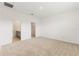 Spacious bedroom featuring neutral carpet, walk-in closet, attached bathroom and plenty of natural light at 9108 Wildlight, Wildwood, FL 34785