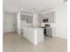 Modern kitchen with gray cabinets, stainless steel appliances, and a kitchen island at 9108 Wildlight, Wildwood, FL 34785
