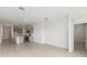 Open floor plan with tile flooring connecting the living area and kitchen at 9108 Wildlight, Wildwood, FL 34785