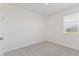 Clean bedroom offering neutral carpet, natural light from a bright window, and a closet at 9113 Wildlight, Wildwood, FL 34785