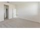 Bedroom with neutral carpet, fresh paint, and ample natural light with a doorway in the background at 9113 Wildlight, Wildwood, FL 34785