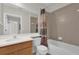 Bathroom features a single sink vanity, toilet, and shower-tub combo at 9435 Myrtle Creek Ln # 308, Orlando, FL 32832