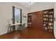 Bright Bedroom with laminate flooring, built-in bookcase and world map art at 9435 Myrtle Creek Ln # 308, Orlando, FL 32832