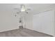 Bright bedroom features a ceiling fan, neutral walls, carpet, and a closet for ample storage space at 9435 Myrtle Creek Ln # 308, Orlando, FL 32832