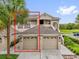 Inviting condo features a two-car garage and well-manicured landscaping at 9435 Myrtle Creek Ln # 308, Orlando, FL 32832