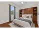 Comfortable Main bedroom featuring laminate flooring, built-in shelves and window at 9435 Myrtle Creek Ln # 308, Orlando, FL 32832