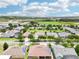 A beautiful aerial view of the homes in the neighborhood on a sunny day at 106 Mist Flower Ln, Groveland, FL 34736
