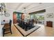 Elegant dining room with a large table, stylish decor, and access to the patio at 106 Mist Flower Ln, Groveland, FL 34736