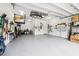 Well-organized garage with ample storage space for tools, equipment, and vehicles at 106 Mist Flower Ln, Groveland, FL 34736