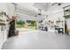 Spacious two-car garage with open door to the driveway, offering convenience and ample parking at 106 Mist Flower Ln, Groveland, FL 34736