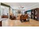 Spacious living room with tile floors, ample seating, and an open layout at 106 Mist Flower Ln, Groveland, FL 34736