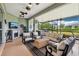 Inviting sunroom with comfortable seating, fireplace, and hot tub, perfect for relaxation and entertaining at 106 Mist Flower Ln, Groveland, FL 34736