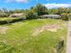 Aerial view of home, surrounding area and landscaping at 12130 Lakeshore Dr, Clermont, FL 34711