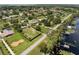 Aerial view features a neighborhood with lake access and a golf course nearby at 12130 Lakeshore Dr, Clermont, FL 34711