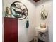 Unique bathroom design showcasing deer-themed decor and vintage-style sink against painted brick wall at 12130 Lakeshore Dr, Clermont, FL 34711