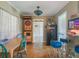 A vintage dart board, a Ford bar table, and unique decor create a fun gaming area at 12130 Lakeshore Dr, Clermont, FL 34711