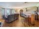Spacious living area with parquet floors, bar area, and comfortable seating at 12130 Lakeshore Dr, Clermont, FL 34711