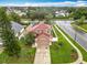 Aerial view of home showcasing the roof, manicured lawn, driveway, and surrounding neighborhood at 12300 Abberton Ct, Orlando, FL 32837