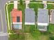 Aerial view of three homes showcasing different roof types, screened pools, landscaping, and neighborhood layout at 12300 Abberton Ct, Orlando, FL 32837