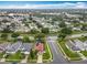 Aerial shot capturing the community, showcasing the property's screened-in pool and charming neighborhood setting at 12300 Abberton Ct, Orlando, FL 32837