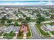 Aerial view showcasing a single Gathering home with enclosed pool and mature trees in a desirable neighborhood at 12300 Abberton Ct, Orlando, FL 32837
