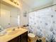 Bright bathroom featuring tub/shower combo with decorative accents at 12300 Abberton Ct, Orlando, FL 32837