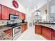 Bright kitchen featuring stainless steel appliances, granite countertops, and a breakfast nook at 12300 Abberton Ct, Orlando, FL 32837