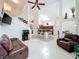 Open-concept living room showcasing high ceilings, a kitchen island, and cozy seating at 12300 Abberton Ct, Orlando, FL 32837