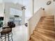 Open living area with a staircase, high ceiling, and access to outdoor area at 12300 Abberton Ct, Orlando, FL 32837