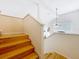 Staircase with wood steps and white railings leading to the second floor at 12300 Abberton Ct, Orlando, FL 32837