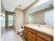 Well lit bathroom with a large mirror and separate shower at 13055 Overstreet Rd, Windermere, FL 34786